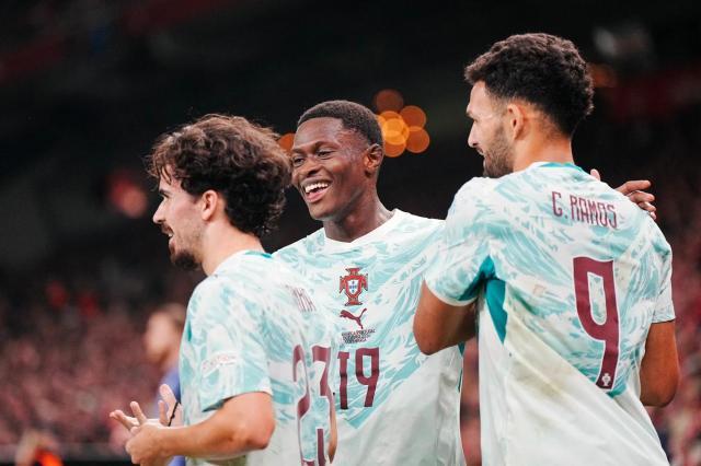 1790900052723078589.jpg Portugal-s-midfielder-Vitinha-celebrates-scoring-a-against-Norway-with-teammates-Nuno-Mendes-and-Goncalo-Ramos (1).jpg